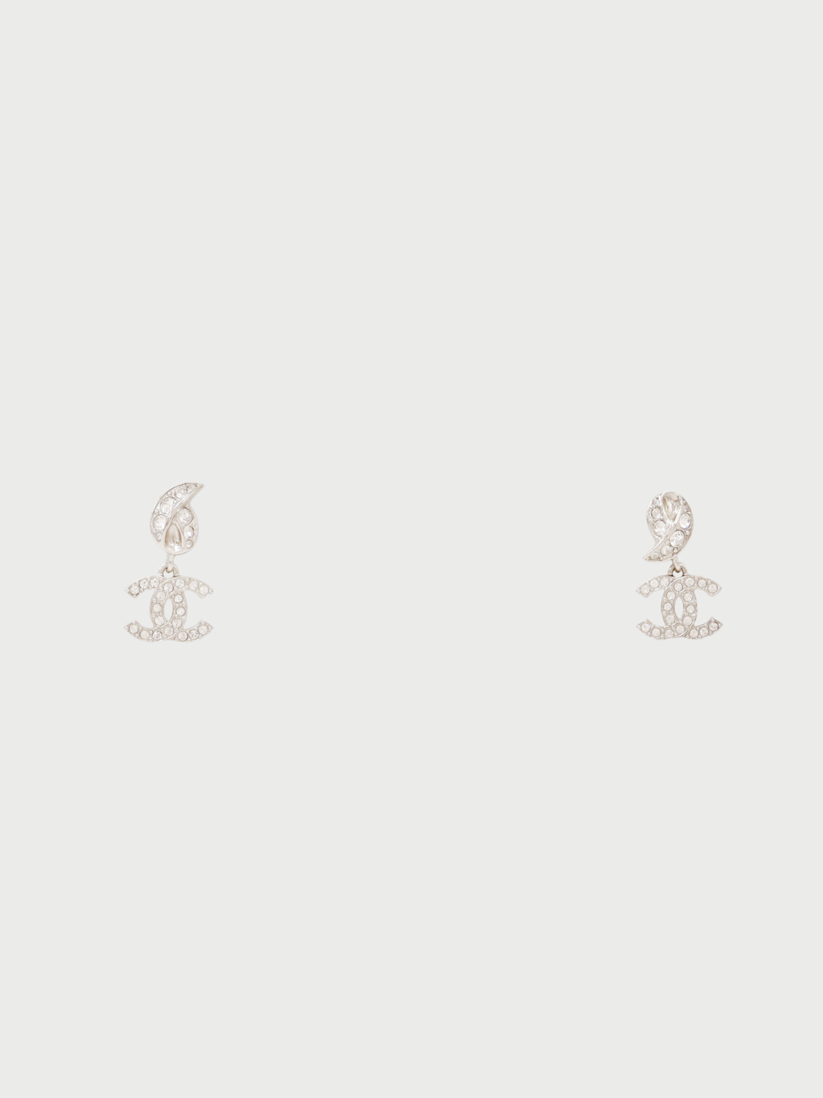 Chanel 2025 Silver Plated Metal COCO Rhinestone Swing Earrings