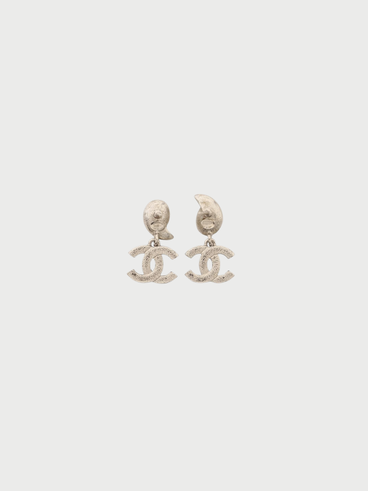 Chanel 2025 Silver Plated Metal COCO Rhinestone Swing Earrings