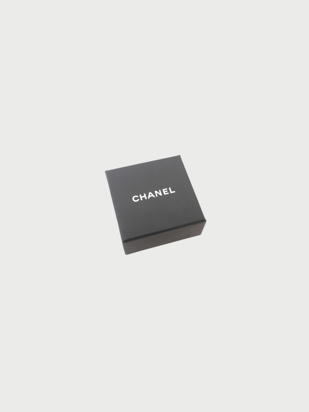 Chanel 2025 Silver Plated Metal COCO Rhinestone Swing Earrings