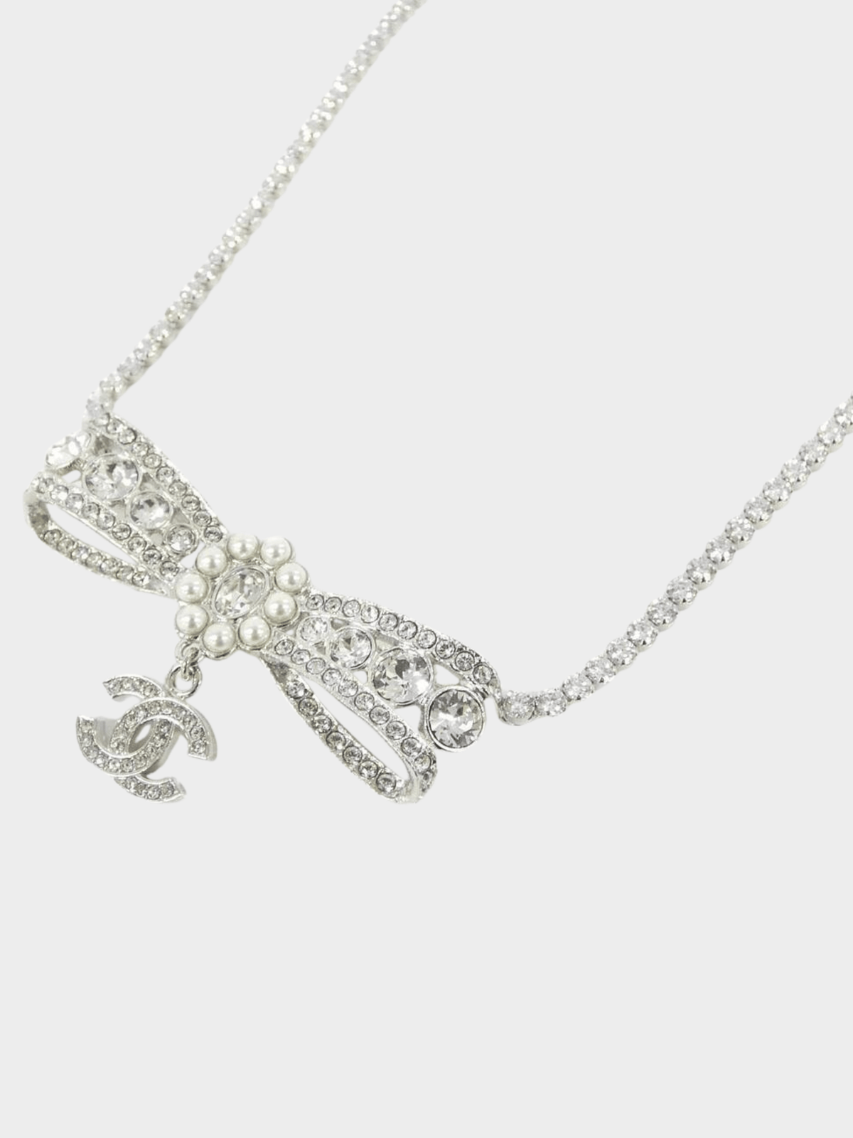 Chanel 2000s Silver Crystal Bow CC Pendant